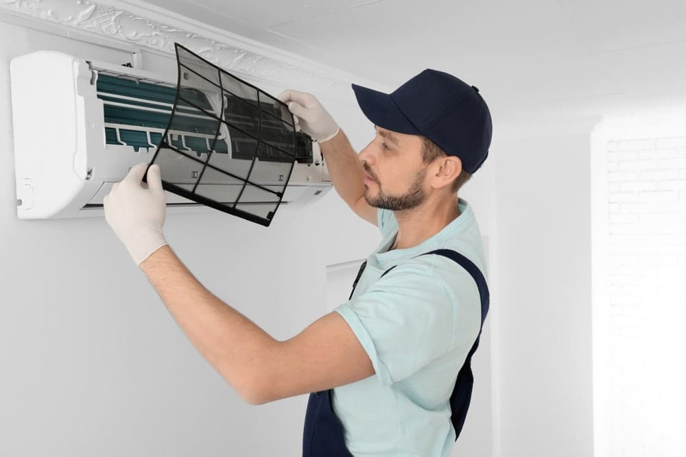 Male,Technician,Cleaning,Air,Conditioner,Indoors