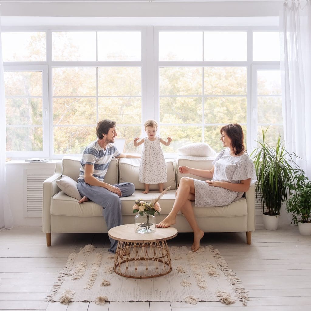 happy-family-is-sitting-on-light-sofa-in-the-livin-2025-03-14-18-49-38-utc 2