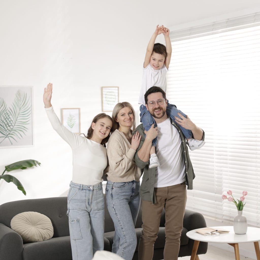 portrait-of-happy-parents-with-their-kids-at-home-2025-06-08-08-57-33-utc 2